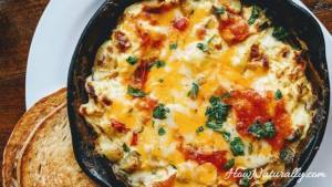 Scrambled eggs with tomatoes and spinach